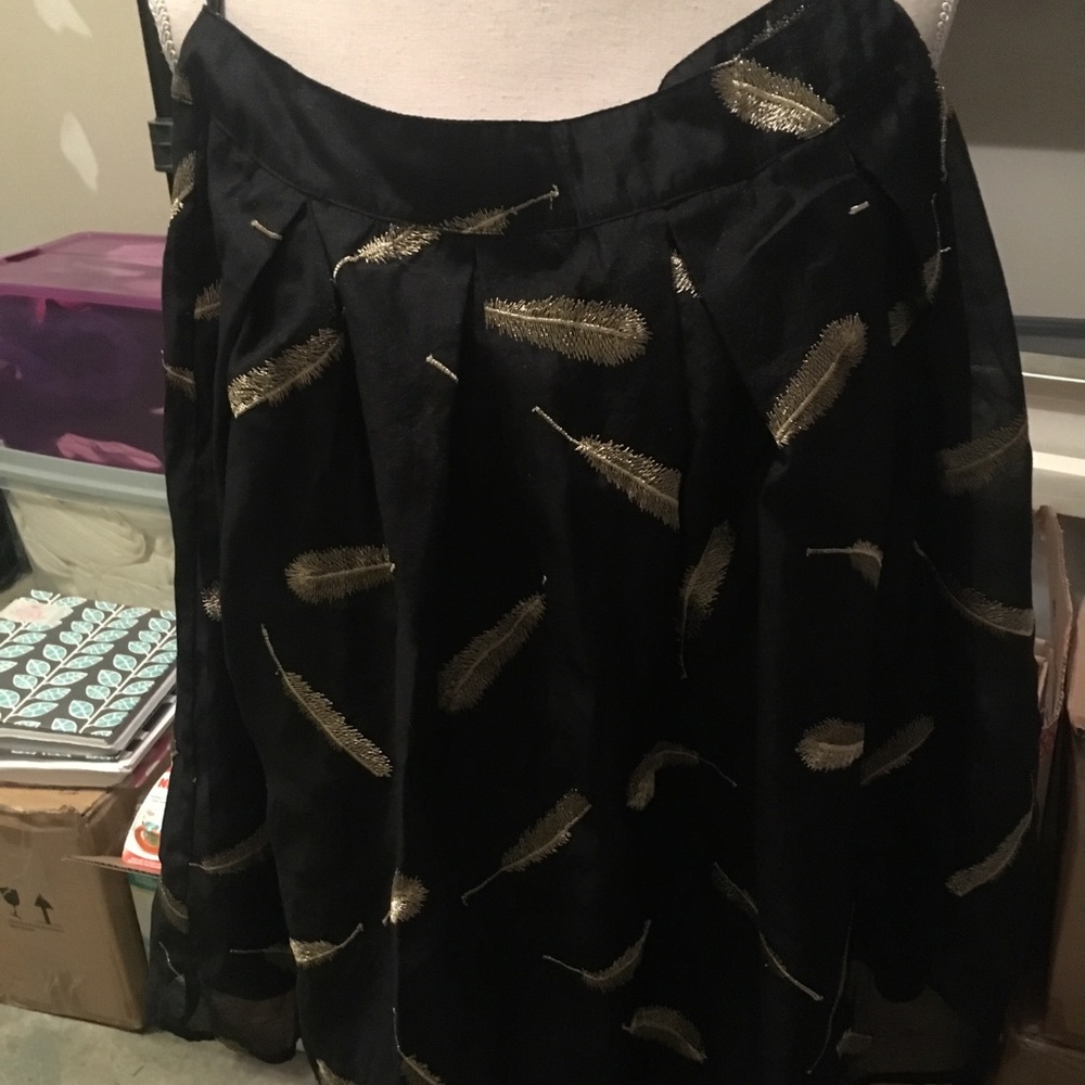 Gorgeous satin black skirt with feather detail